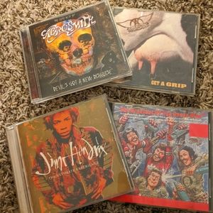 4- CD's (Jimi Hendrix, The Who, and 2 Aerosmith)